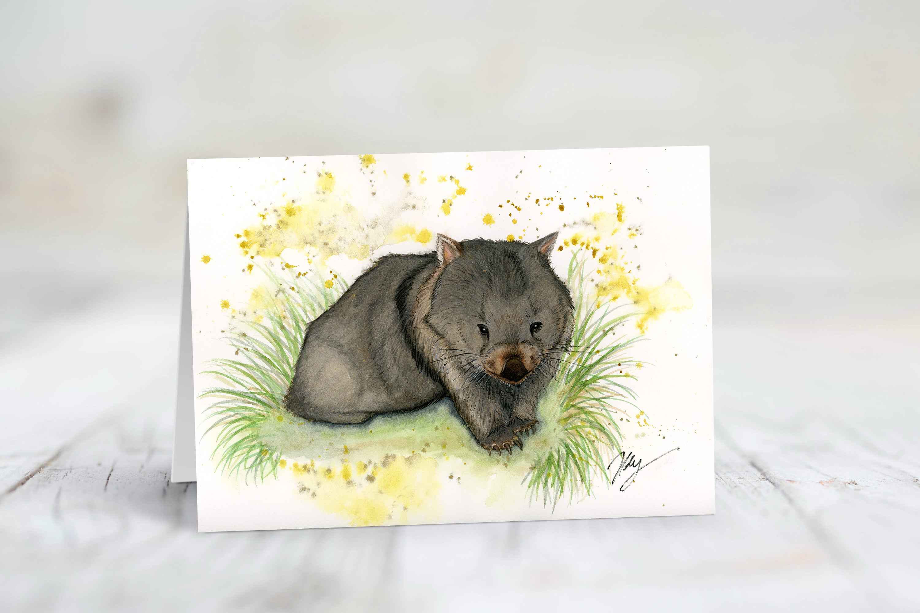 Card with a wombat illustration on a white background